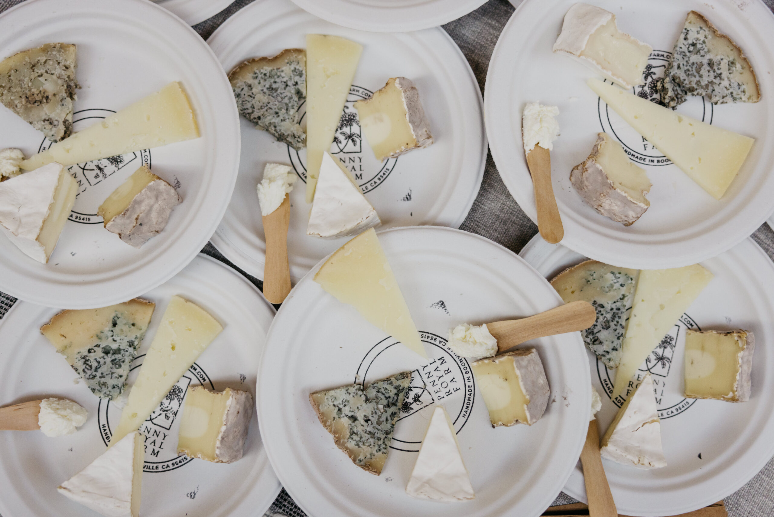 four small pieces of cheese on white plate